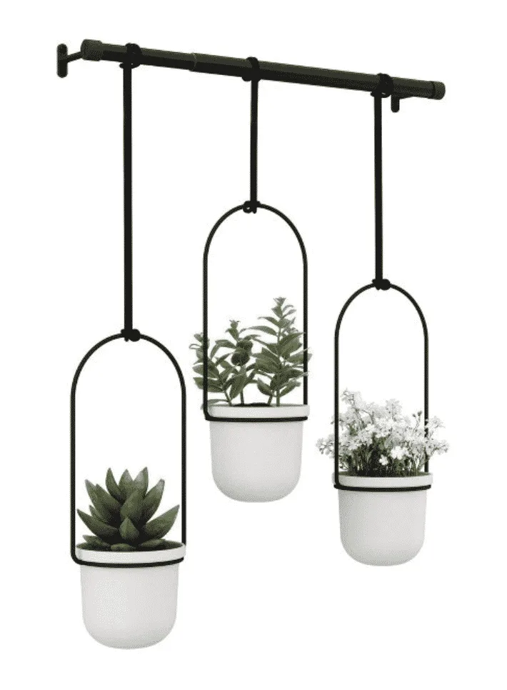 Industrial style hanging planter with three white pots and plants inside available at target.