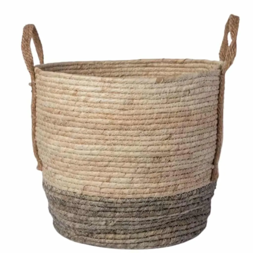 handwoven natural seagrass planter with handles on each side. natural tone with darker coloring around base to buy on etsy